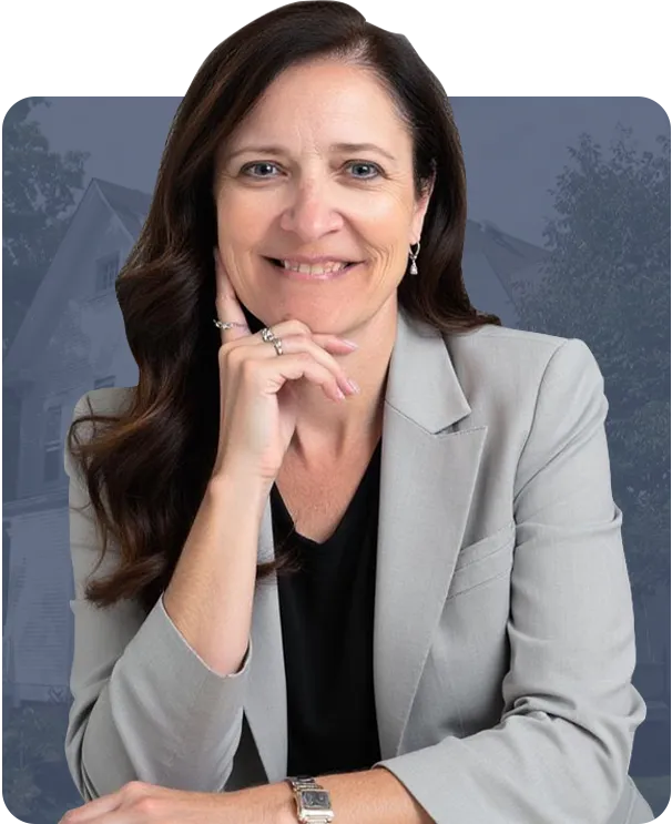 Nicole Hanson, lead agent of the Nicole Hanson Group, standing in front of a residential property